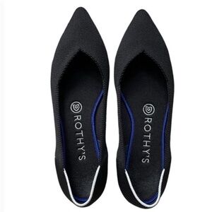 The Point Rothy's shoes solid black with a white halo border/ outline in blue.